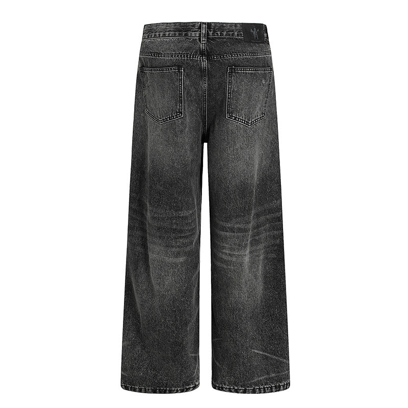 Washed and ground white distressed jeans