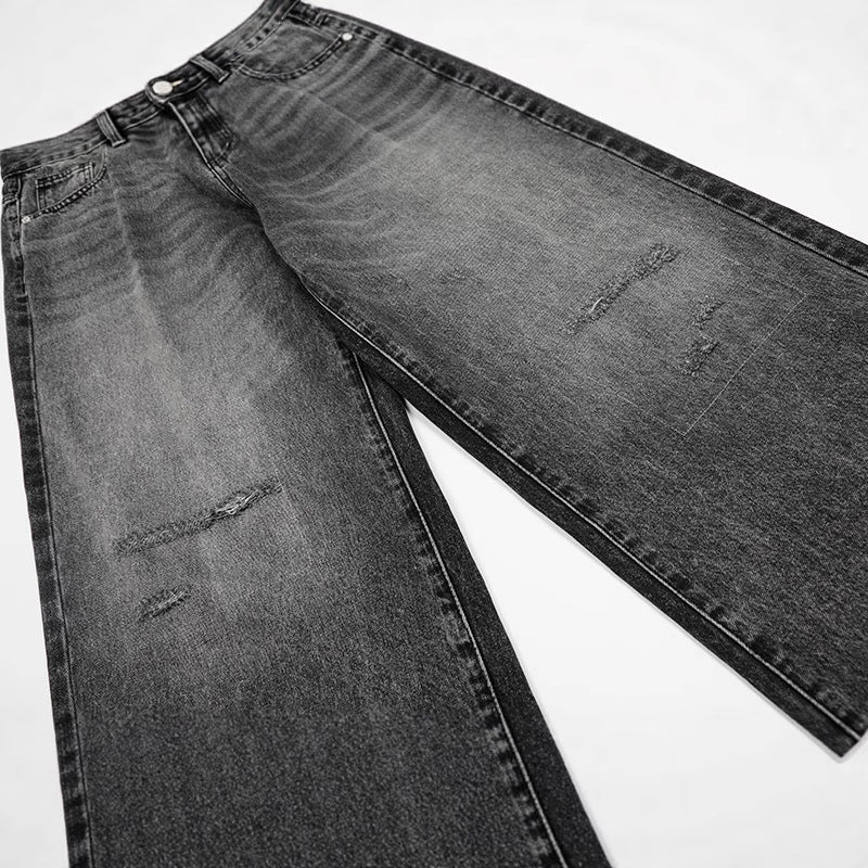 Washed and ground white distressed jeans
