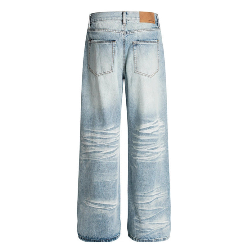 Used washed scratched and ground white straight leg jeans