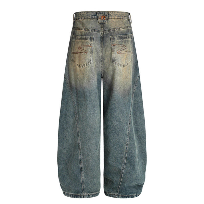 Washed denim jeans with an old silhouette and curved edges