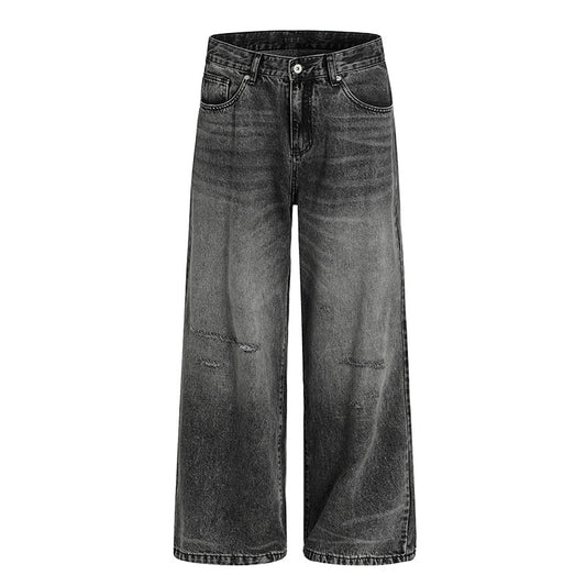 Washed and ground white distressed jeans